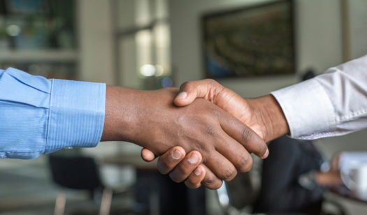 two-people-shaking-hands.jpg two people shaking hands